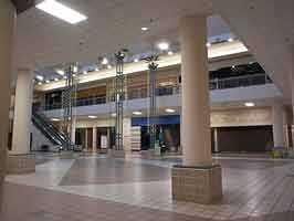 The northern storefronts in the west court of the Crossroads Mall. Storefronts like Bath and Body Works, Victoria's Secret, and Finish Line are visible, all empty.